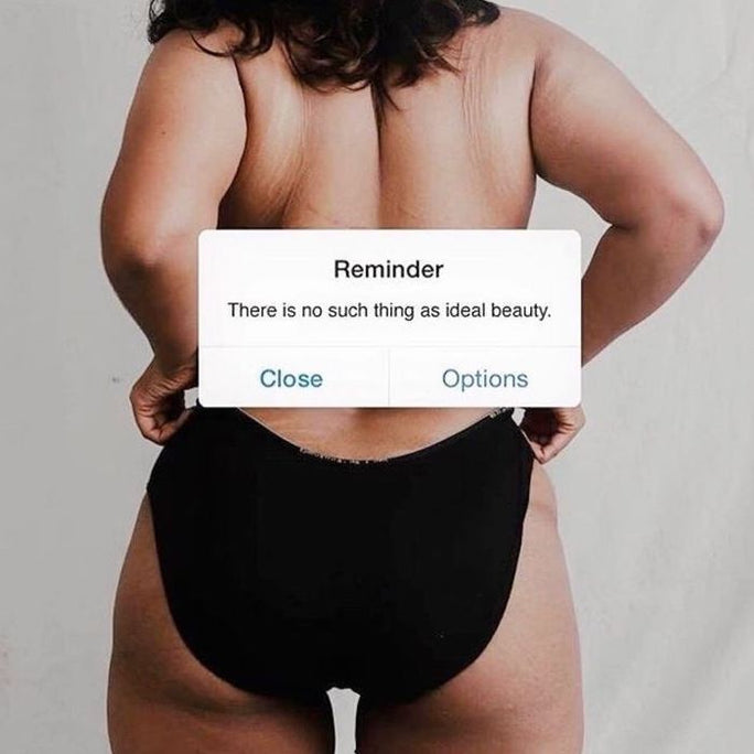 Phone background with a reminder message: There is no such thing as ideal beauty
