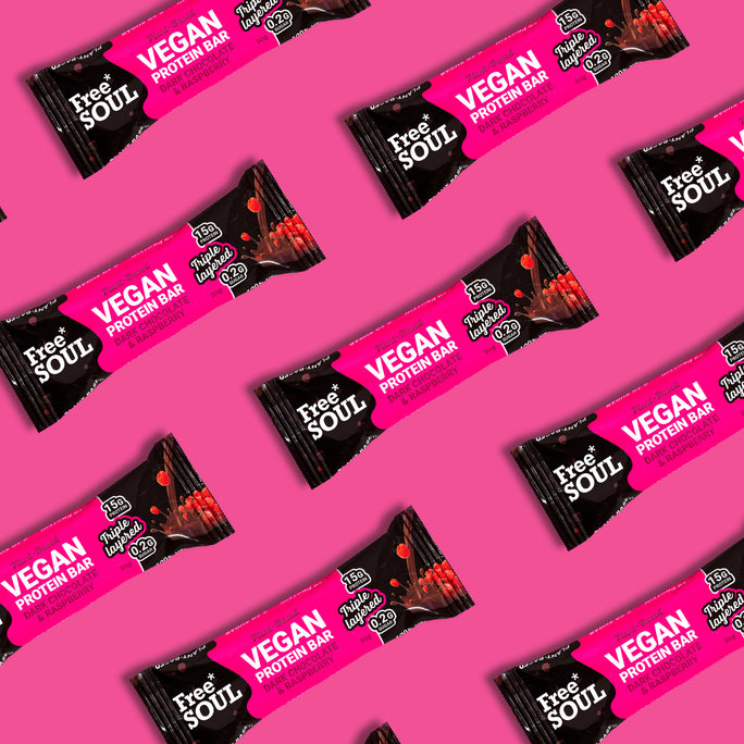 Free Soul vegan protein bars on a pink background