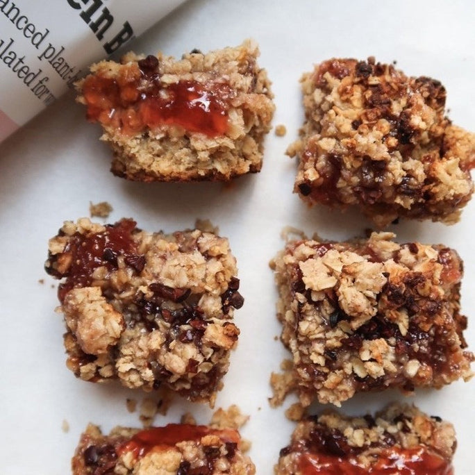 Small flapback bites with light red jam next to a bag of Free Soul protein