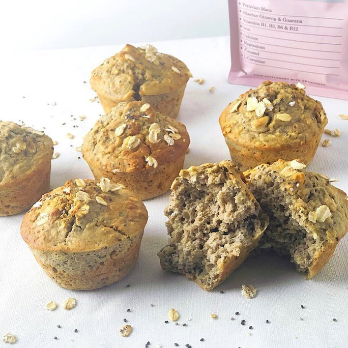 Muffins with nuts on top in front of the packaging