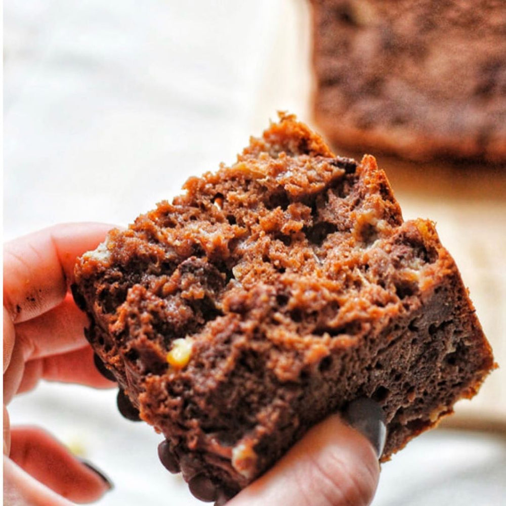 Closeup of a person holding a brownie