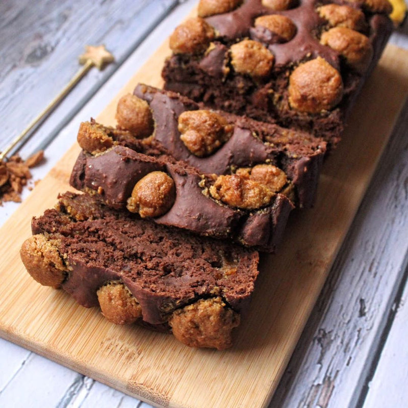 Slices of chocolate brownie with nuts on a wooden board
