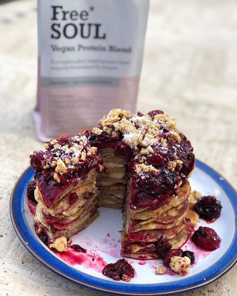 Free Soul protein pancakes stacked on a blue and white plate