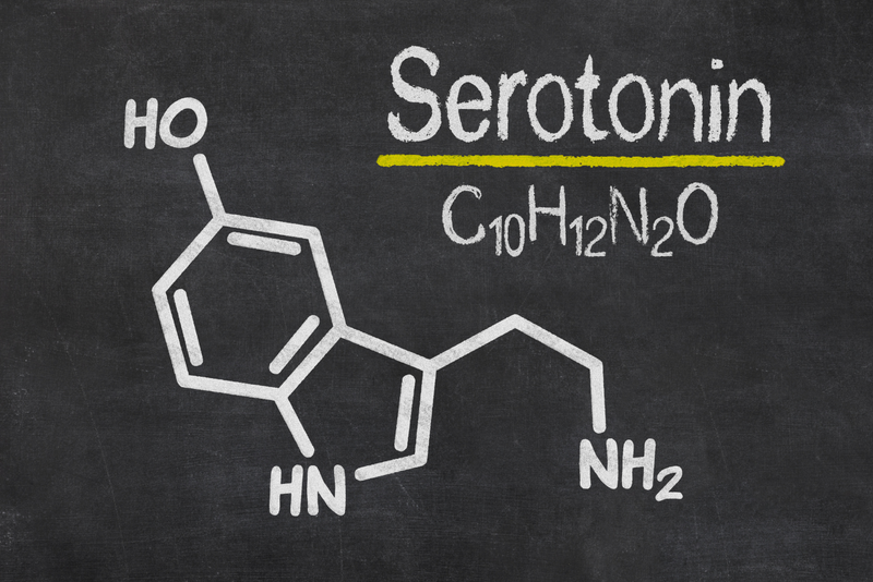 a blackboard with the chemical diagram of serotonin