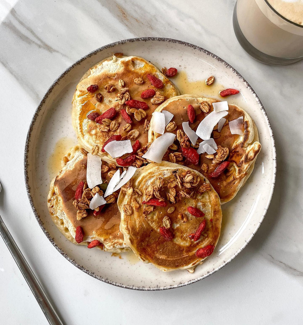 Golden pancakes topped with oats and coconut