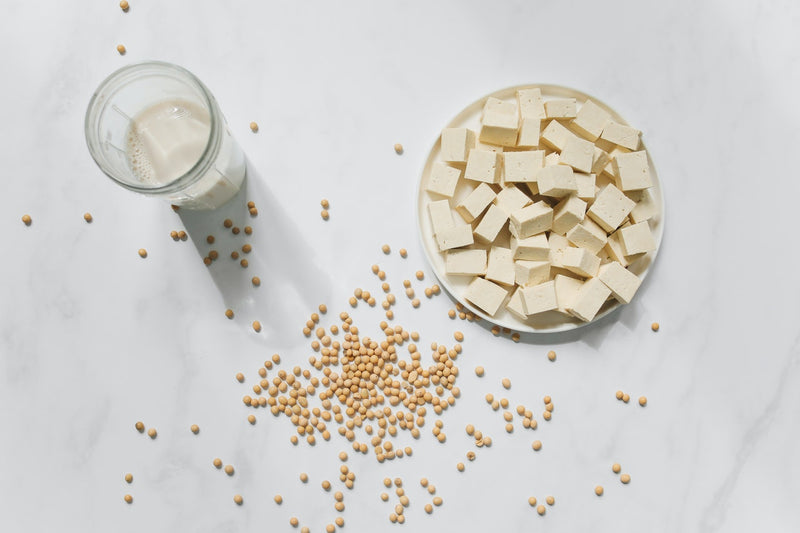 Cubed tofu, yellow peas and a cup of plant-based milk