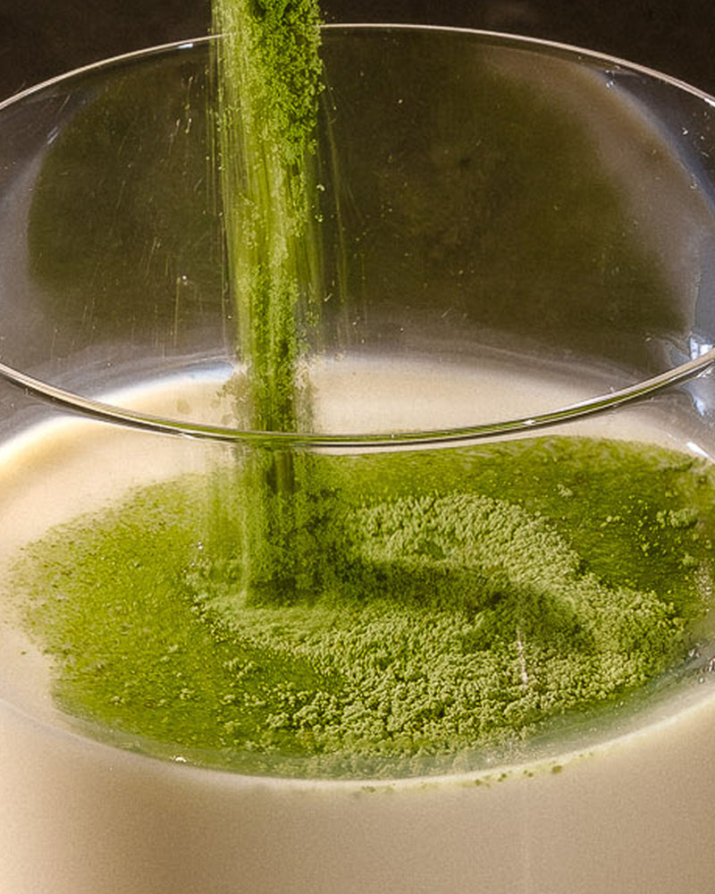 Add two heaped tablespoons (25g) of Matcha Protein Powder to your shaker or glass.